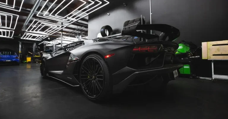Black matte Lamborghini Aventador is standing in a showroom