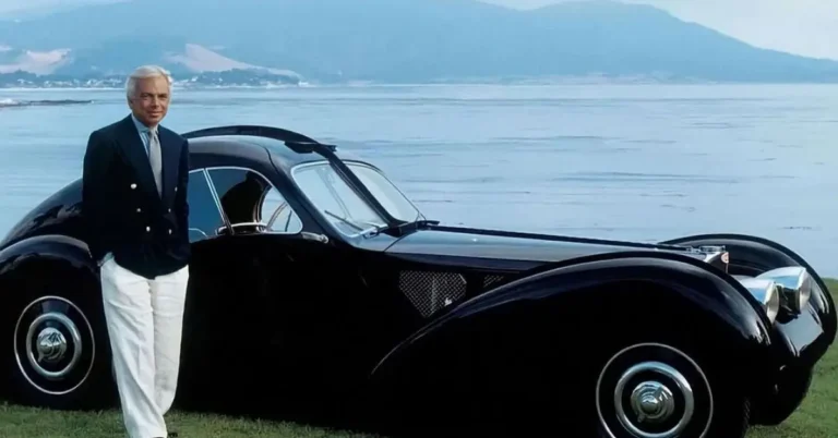 Ralpf Lauren and his 1938 Bugatti in Front of Mountains and a Sea