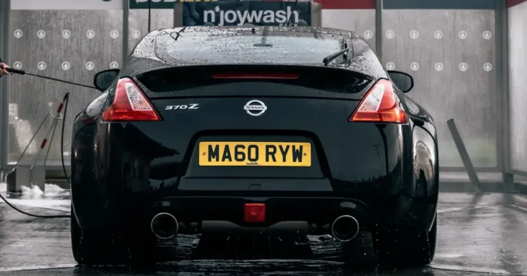 Black Nissan 370Z standing in a washing lot