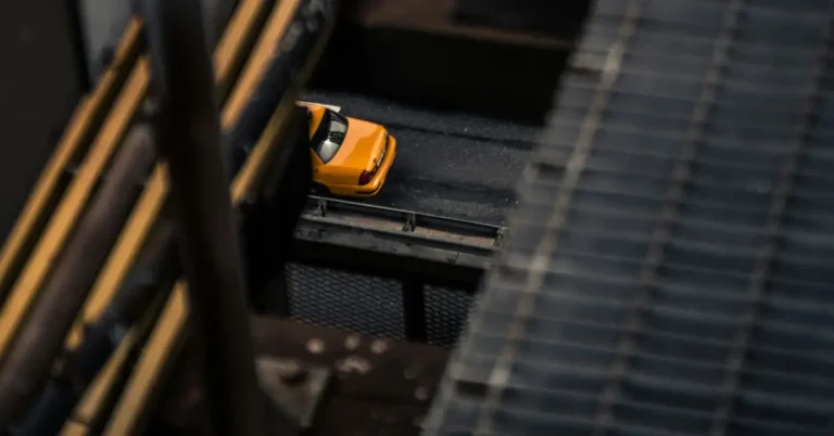 A cab is standing under a bridge