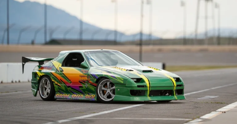 A green Airbrushed Nissan SX240 drifting