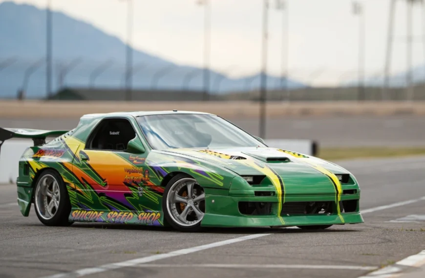 A green Airbrushed Nissan SX240 drifting