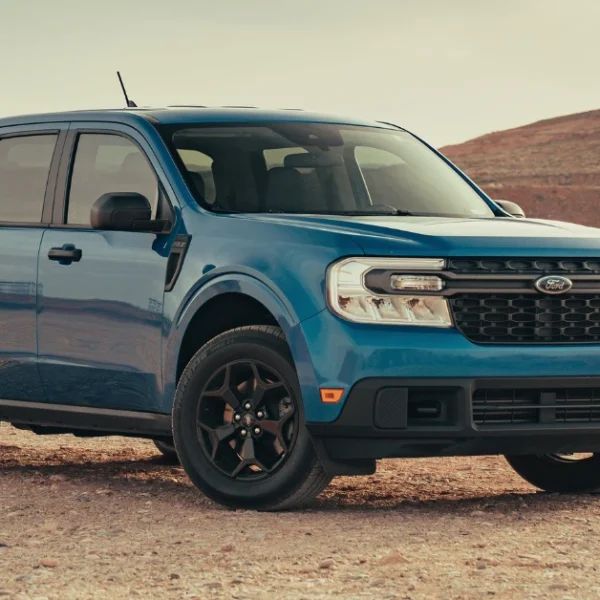 A blue Ford Maverick standing in the desert