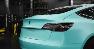 A Tesla wrapped in mint green
