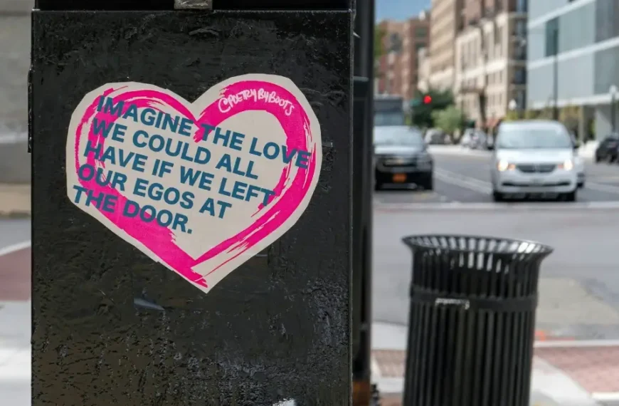 Garbage Can with a sticker on that says "Imagine the Love we could al have if we left our Egos at the Door"