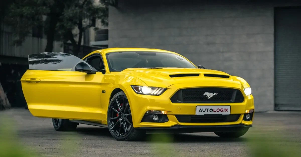 Yellow Ford Mustang Coupe with the Side Door open