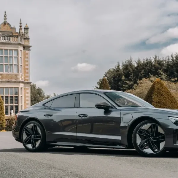 Grey Audi RS e-Tron GT in front of a Castle