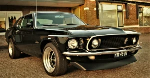 A 1960´s Mustang in Front of a Building