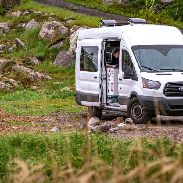 A white Ford Transit in the Nature