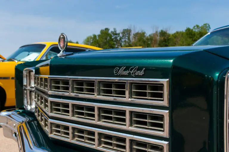 The front of a green, clear coated Cadillac