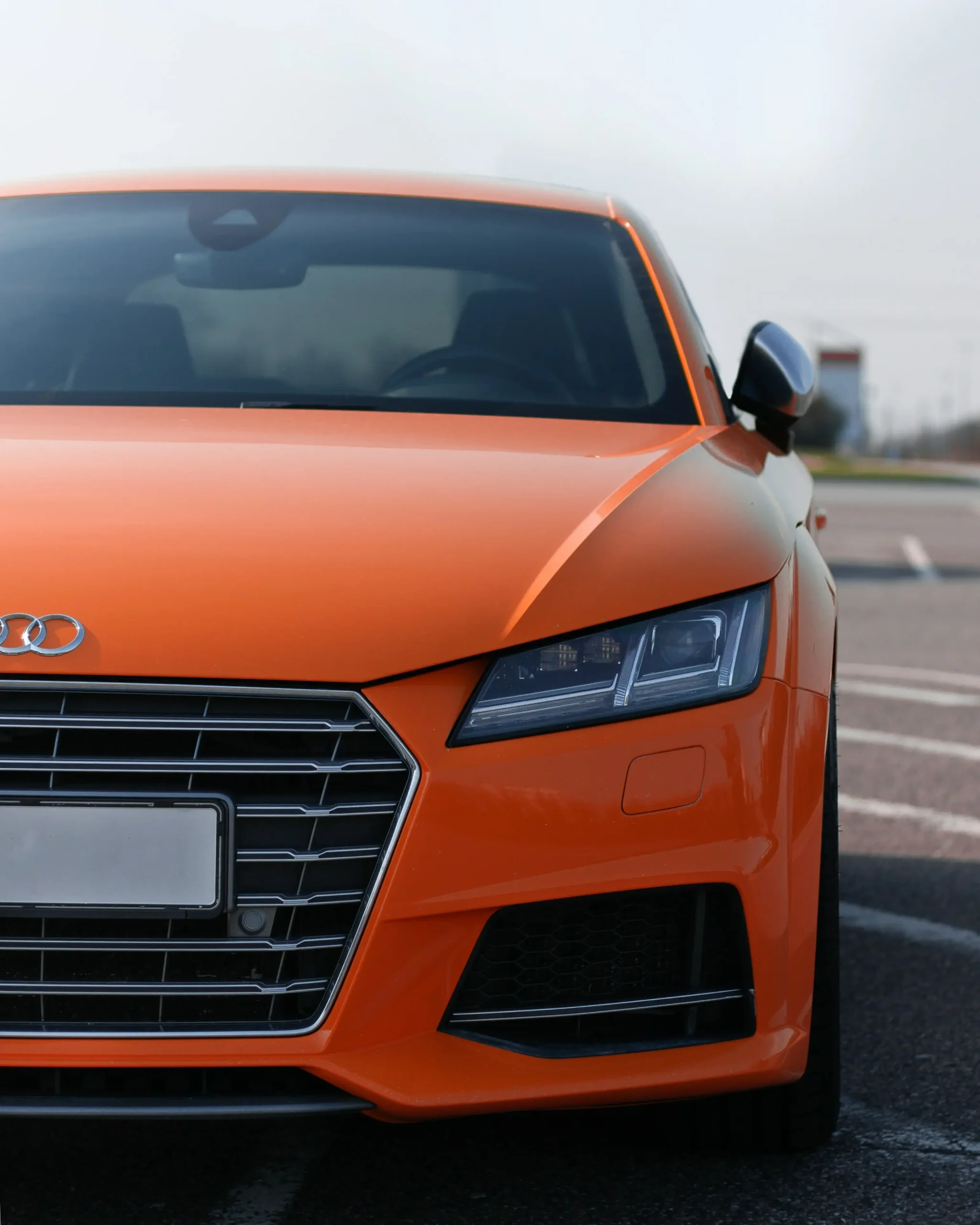 Light tinted Windows on a orange Audi TT