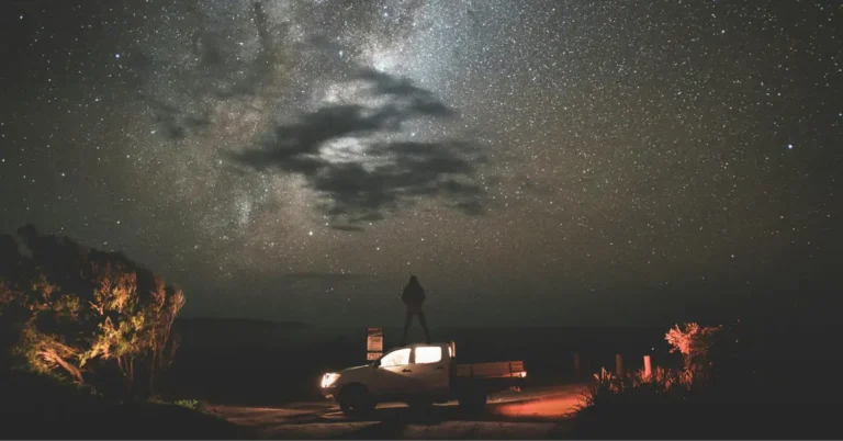 A SUV with a Tent in Front of a big Starsky