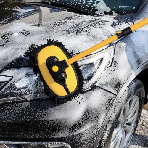 Car gets foamed with an car cleaning brush