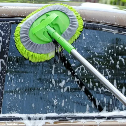 Car Window gets cleanes with a Car cleaning brush
