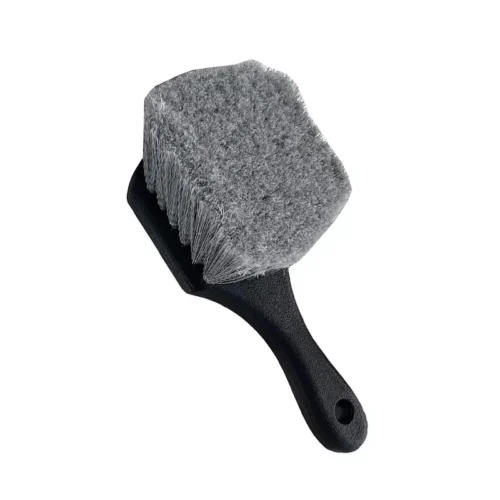 A grey Car wheel cleaning brush
