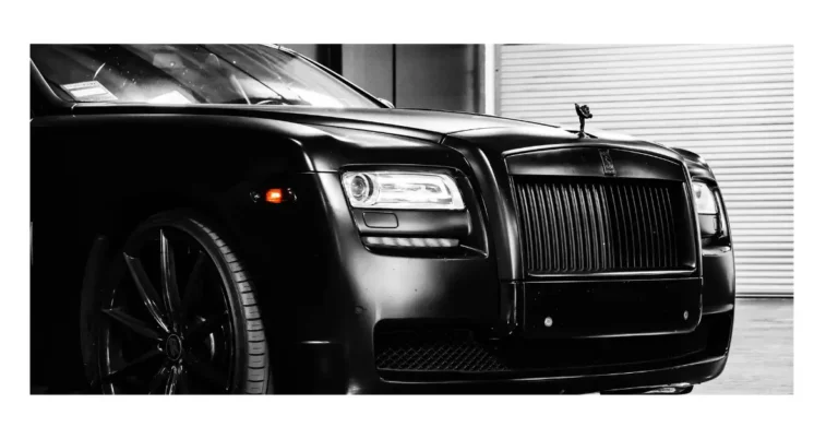 The front of a black Rolls Royce Ghost