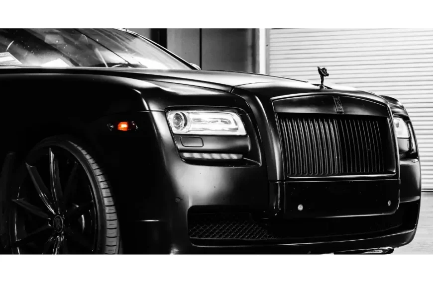 The front of a black Rolls Royce Ghost